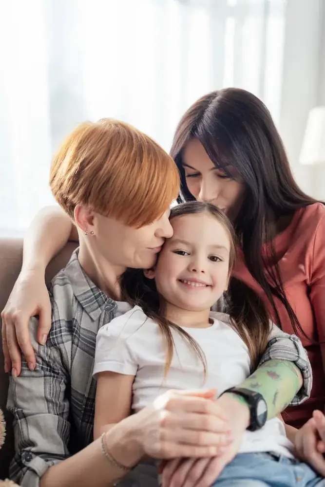 two moms with daughter