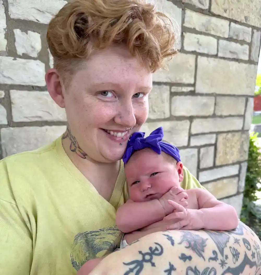ashley's family spotlight, holding newborn